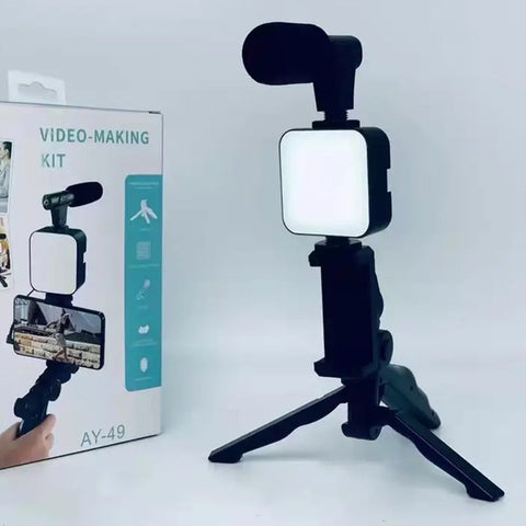 VYRO-7 vlogging kit with mini tripod, microphone, and LED light for video recording and content creation.